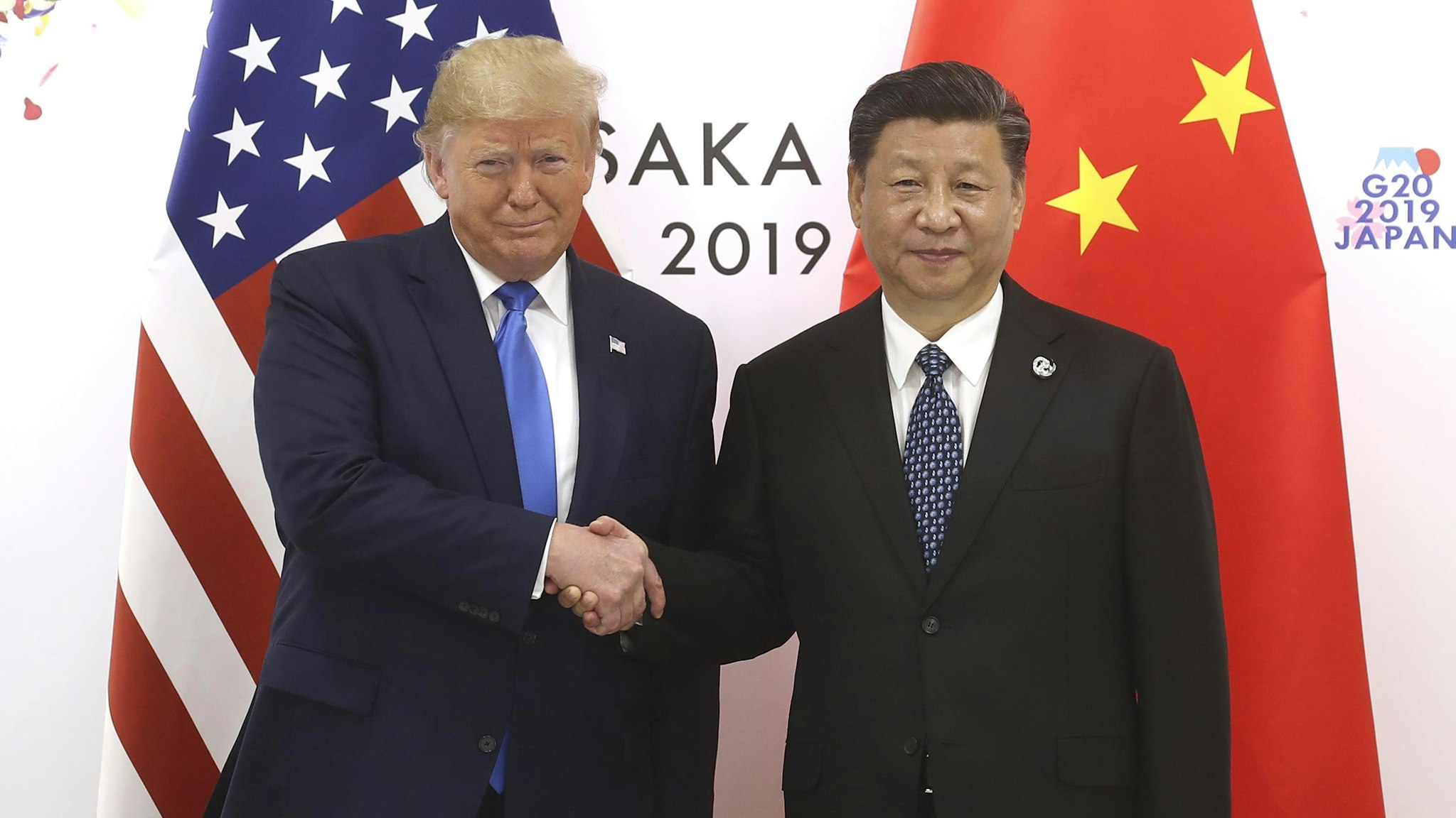 OSAKA, JAPAN - JUNE 29: Chinese President Xi Jinping (R) shakes hands with US President Donald Trump before a bilateral meeting during the G20 Summit on June 29, 2019 in Osaka, Japan.