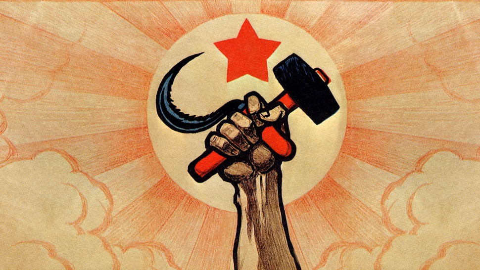 Symbols of communism: the hand wielding the hammer and sickle, in the background the rising sun and the red star ***Long live the fifth anniversary of the Great Proletarian Revolution!***. Color lithograph. Digital optimization from detail of a Ivan Simakov 1922 poster. Italy, Milan 2016.