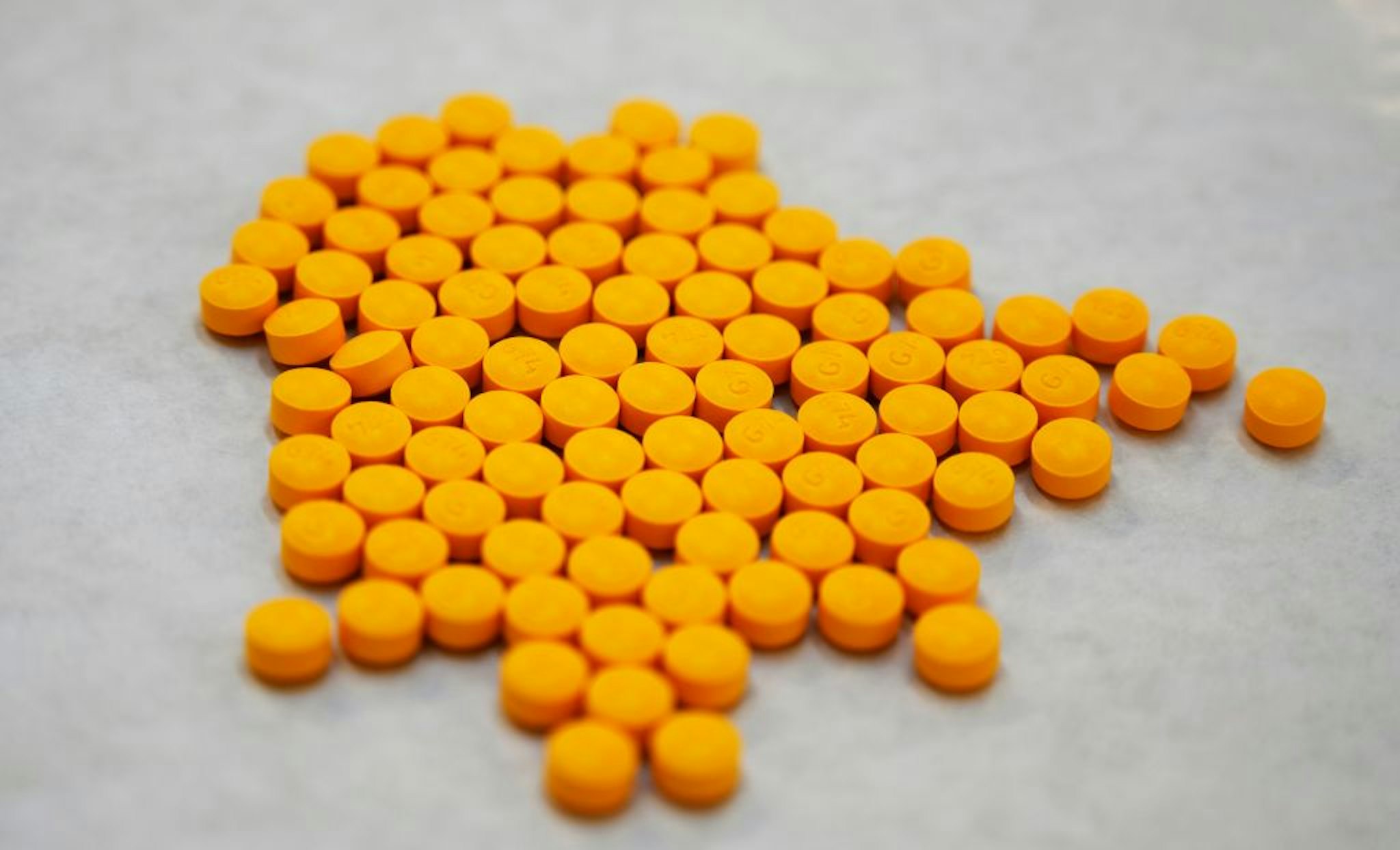 Tablets believed to be laced with fentanyl are displayed at the Drug Enforcement Administration Northeast Regional Laboratory on October 8, 2019, in New York. - According to US government data, about 32,000 Americans died from opioid overdoses in 2018. That accounts for 46 percent of all fatal overdoses. Fentanyl, a powerful painkiller approved by the US Food and Drug Administration for a range of conditions, has been central to the American opioid crisis which began in the late 1990s. (Photo by Don Emmert / AFP)