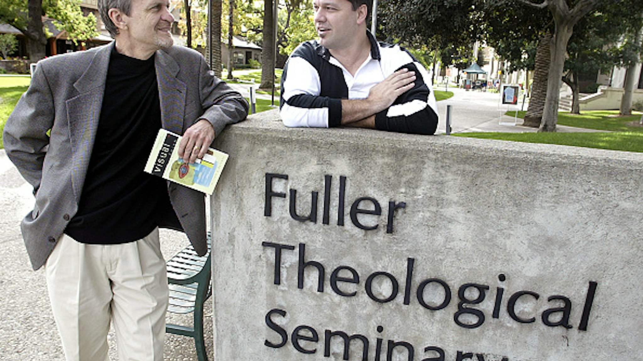 William Dyrness, professor of theology and culture at Fuller Theological Seminary and, mime artist Todd Farley in front of the campus in Pasadena Thursday. Increasingly, churches are integrating all types of art  from visual to dramatic performances, such as mime, in worship.