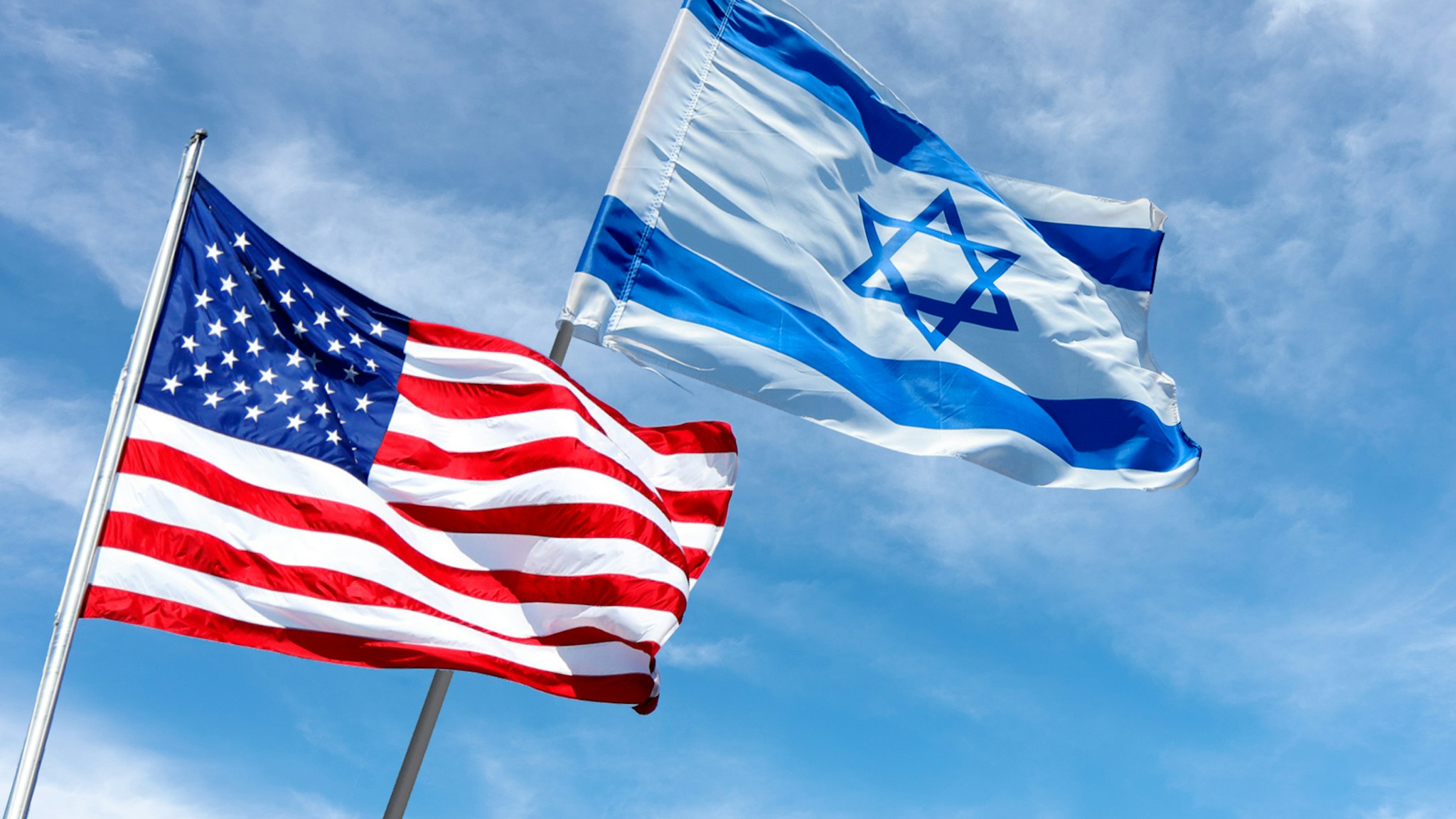 United States and Israel flags near the American Embassy in Jerusalem, Israel