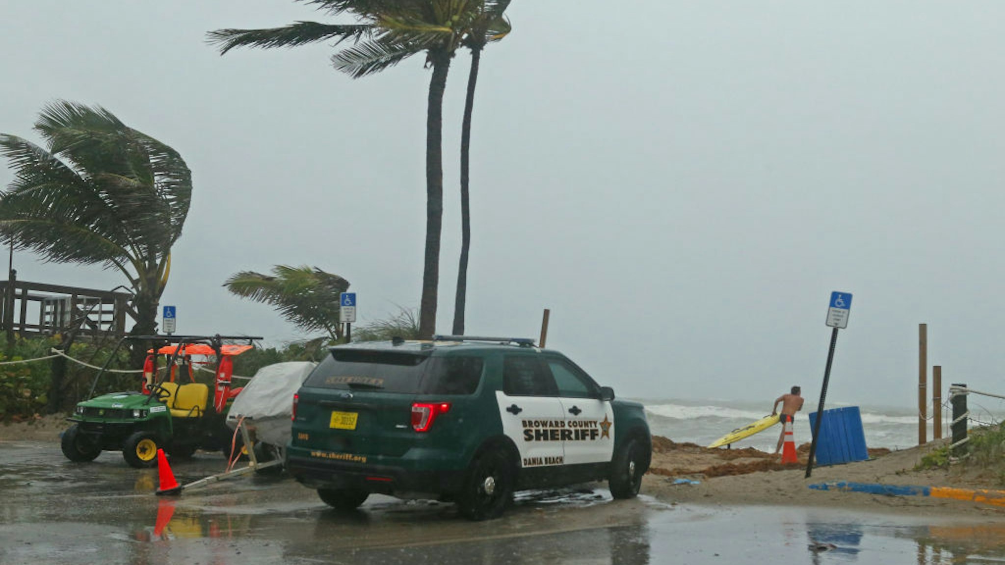 A Broward Sheriff's Office vehicle at the Dania Beach Pier in Dania Beach, Fla., as Tropical Storm Gordon passes by South Florida with wind gusts and heavy rainfall for the Labor Day holiday on Monday, Sept. 3, 2018.