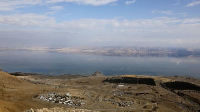 A picture taken on November 24, 2018 shows part of the Dead Sea backdropped by mountains in Jordan as seen from the Judean Desert in the West Bank.