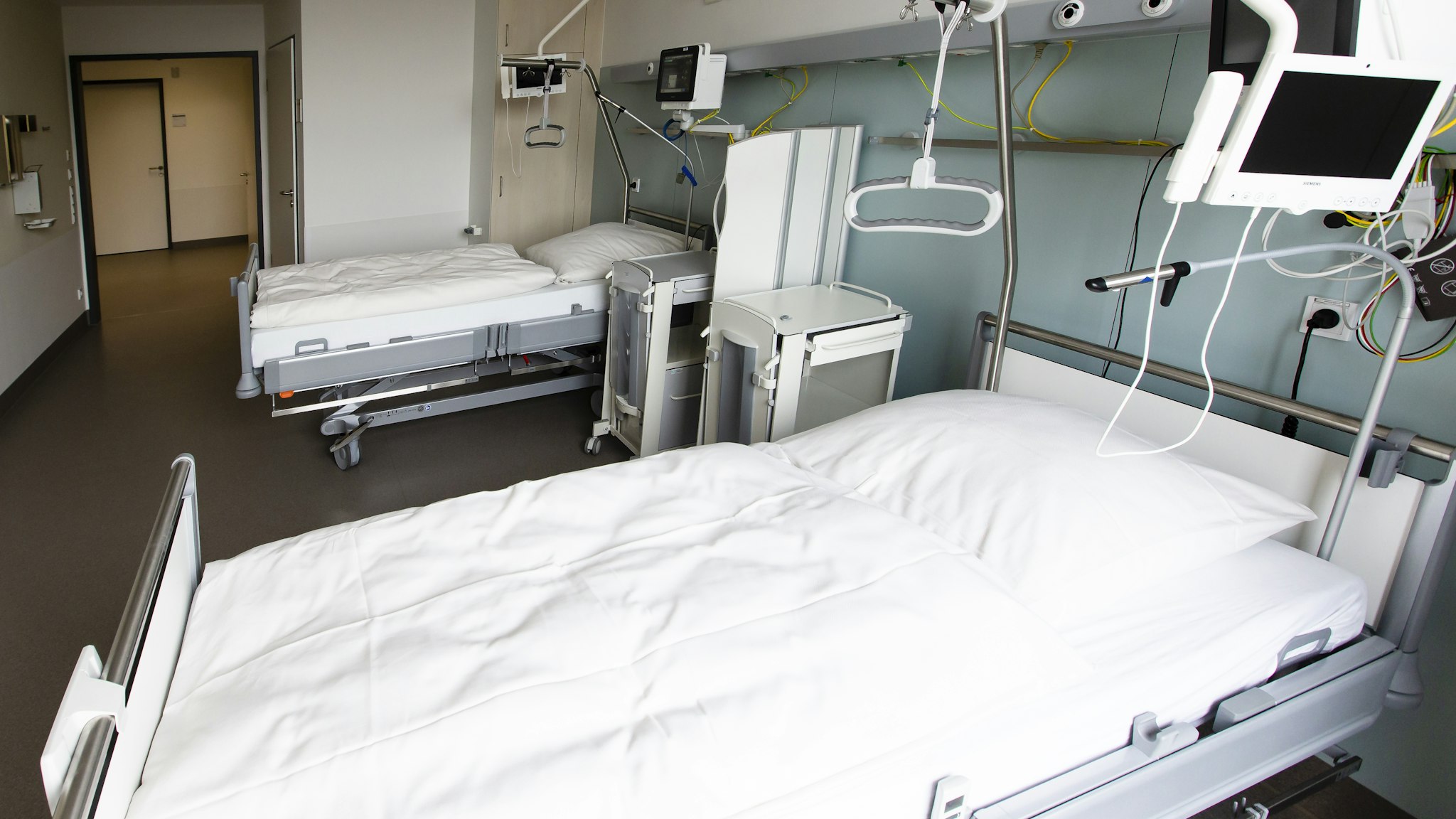 16 August 2019, Schleswig-Holstein, Kiel: Two beds are available in a ward room for patients with statutory health insurance at the University Hospital Schleswig-Holstein (UKSH). After seven years of planning and four years of construction, the more than 300 million UKSH new building of the central building was officially opened on 16 August. Photo: Frank Molter/dpa (Photo by Frank Molter/picture alliance via Getty Images)