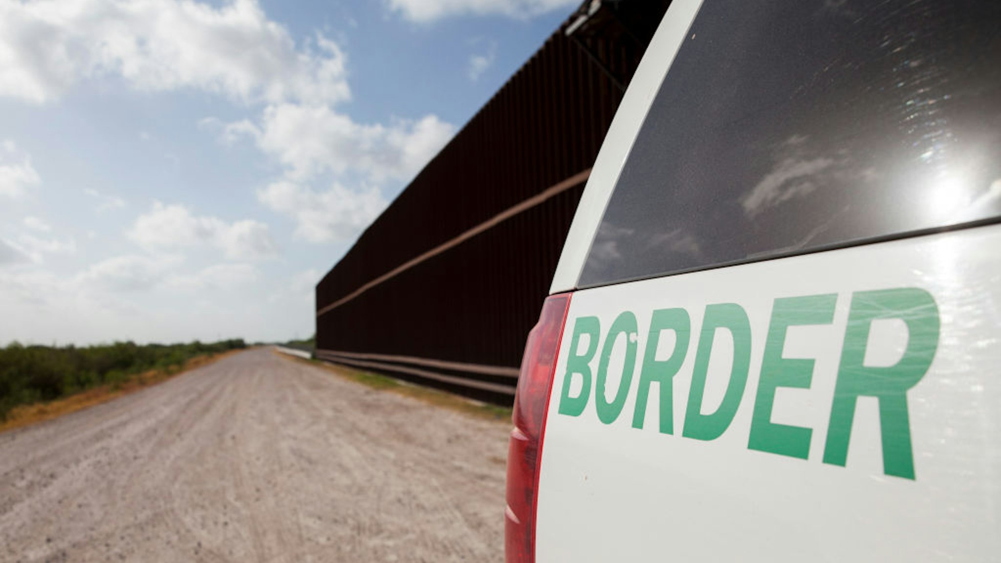 UNITED STATES - AUGUST 20: A Customs and Border Protection vehicle patrols the border wall in Rio Grande Valley sector of the Texas border on Aug. 20, 2019.