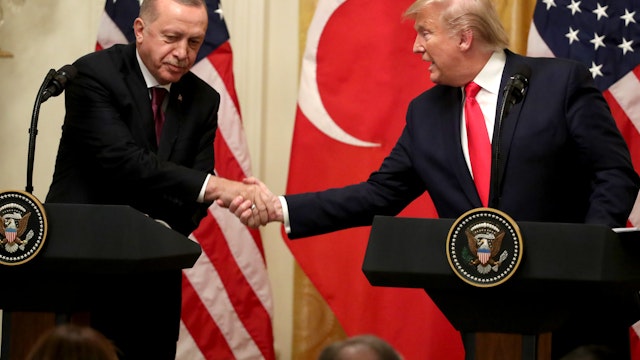WASHINGTON, DC - NOVEMBER 13: U.S. President Donald Trump and Turkish President Recep Tayyip Erdogan shakes hands during a press conference in the East Room of the White House on November 13, 2019 in Washington, DC. During their meeting, Trump and Erdogan were scheduled to discuss Turkey's purchase of a Russian air defense system as well as the Turkish offensive against the Kurds in Syria. (Photo by Mark Wilson/Getty Images)