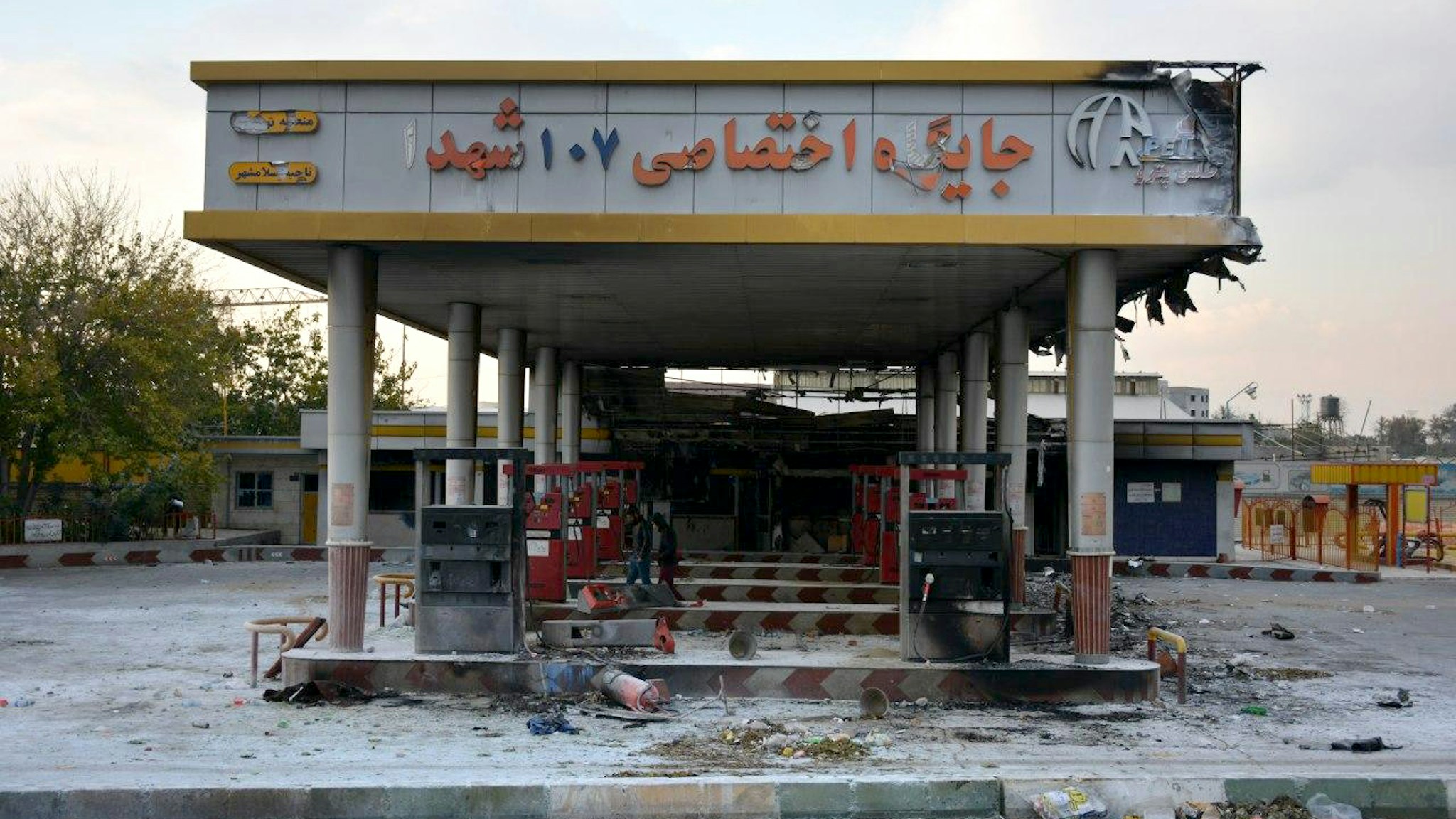 A picture taken on November 17, 2019 shows a scorched gas station that was set ablaze by protesters during a demonstration against a rise in gasoline prices in Eslamshahr, near the Iranian capital of Tehran. - President Hassan Rouhani warned that riot-hit Iran could not allow "insecurity" after two days of unrest killed two people and saw authorities arrest dozens and restrict internet access. Rouhani defended the controversial petrol price hike that triggered the protests -- a project which the government says will finance social welfare spending amid a sharp economic downturn (Photo by - / AFP) (Photo by -/AFP via Getty Images)