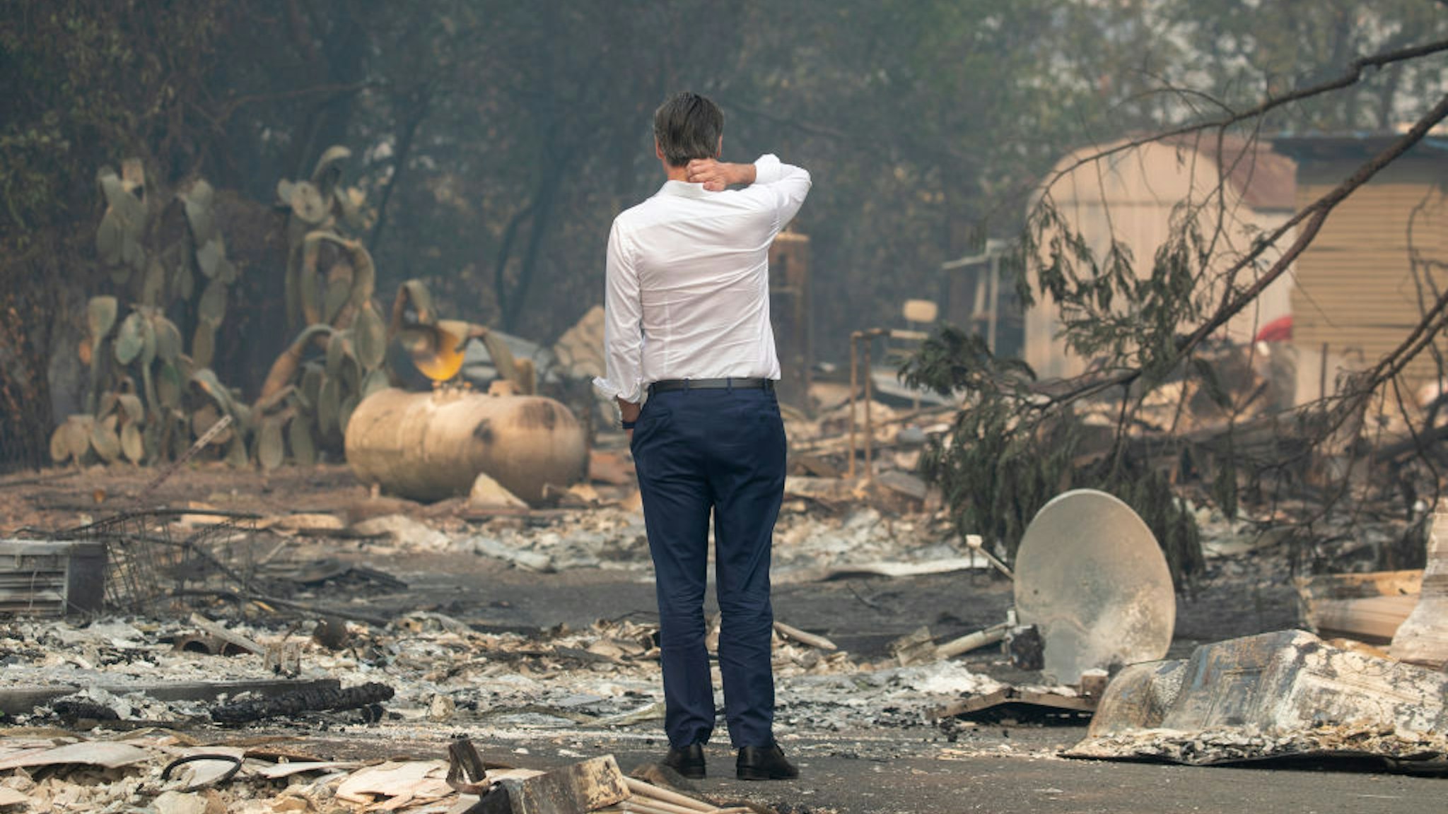 Gov. Gavin Newsom surveys a home destroyed in the Kincade Fire, Friday, Oct. 25, 2019, in Geyserville, Calif.