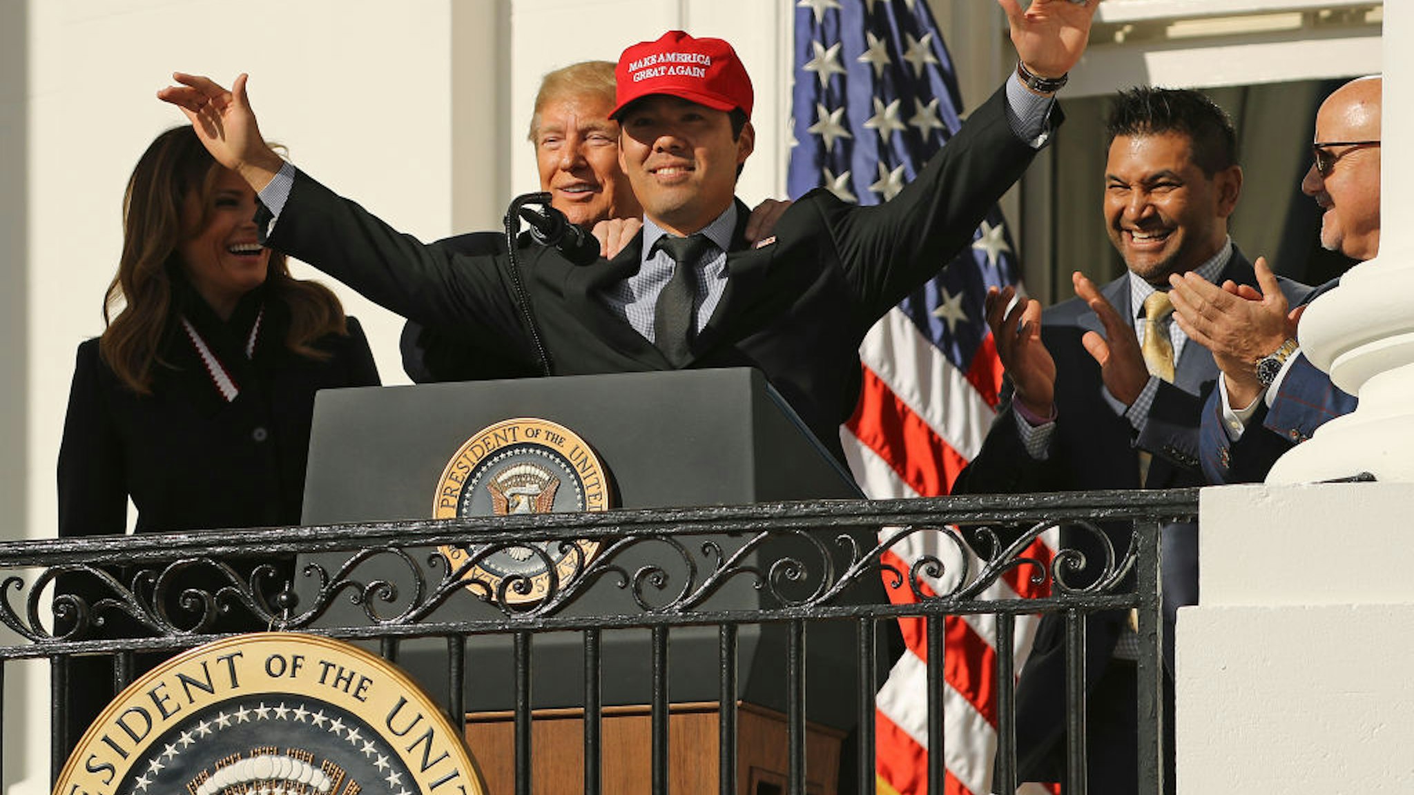 U.S. President Donald Trump reacts to Washington National catcher Kurt Suzuki wearing a 'Make America Great Again' cap during a celebration of the 2019 World Series Champions at the White House November 04, 2019 in Washington, DC. The Nationals are Washington’s first Major League Baseball team to win the World Series since 1924.