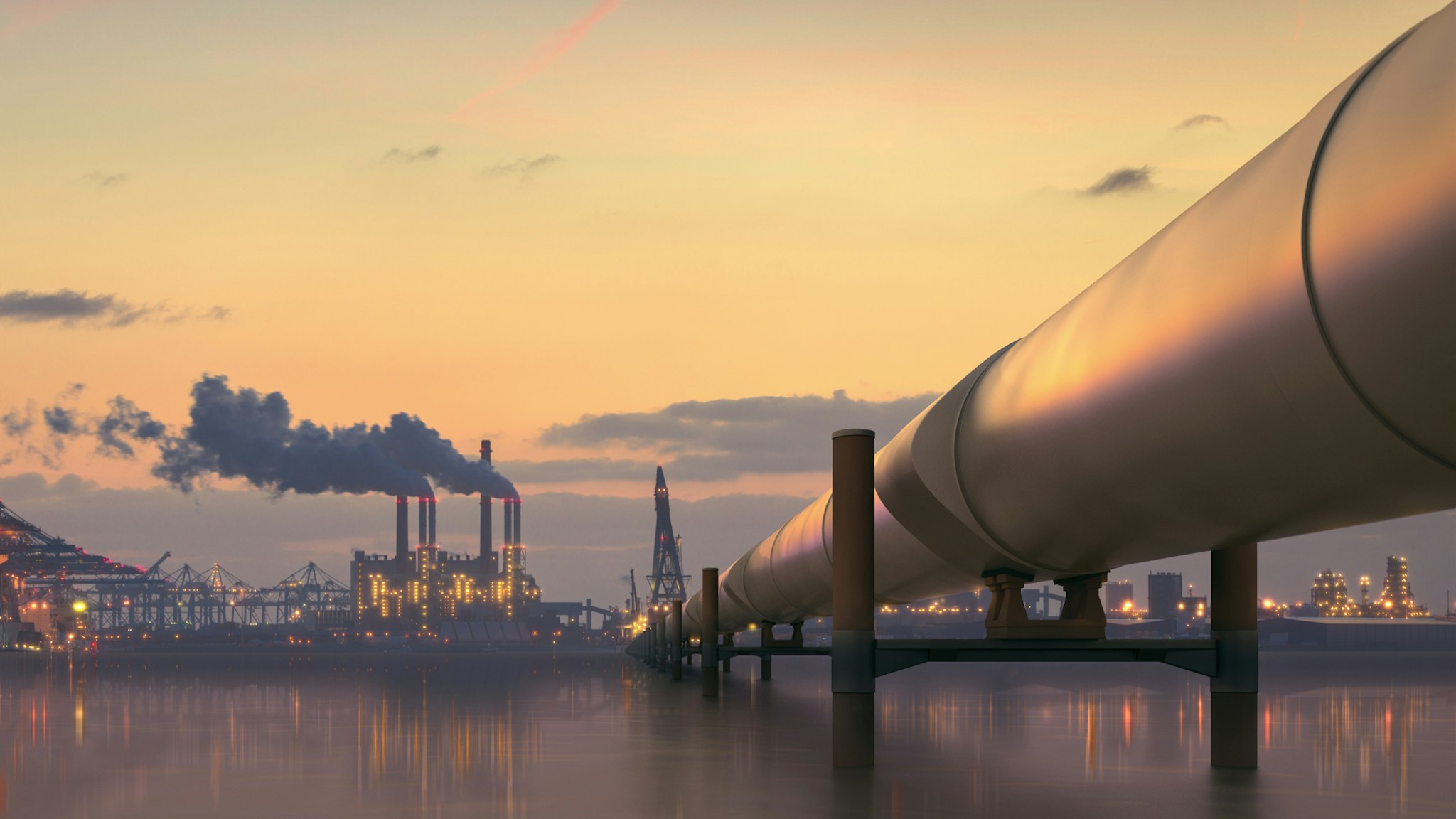 Oil pipeline in industrial district with factories at dusk - stock photo Pipeline in industrial district