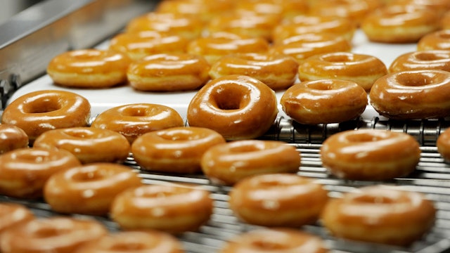 Donuts on the 270 machine at Krispy Kreme in Saco Tuesday, October 3, 2017. The 270 machine makes 270 dozen donuts per hour.