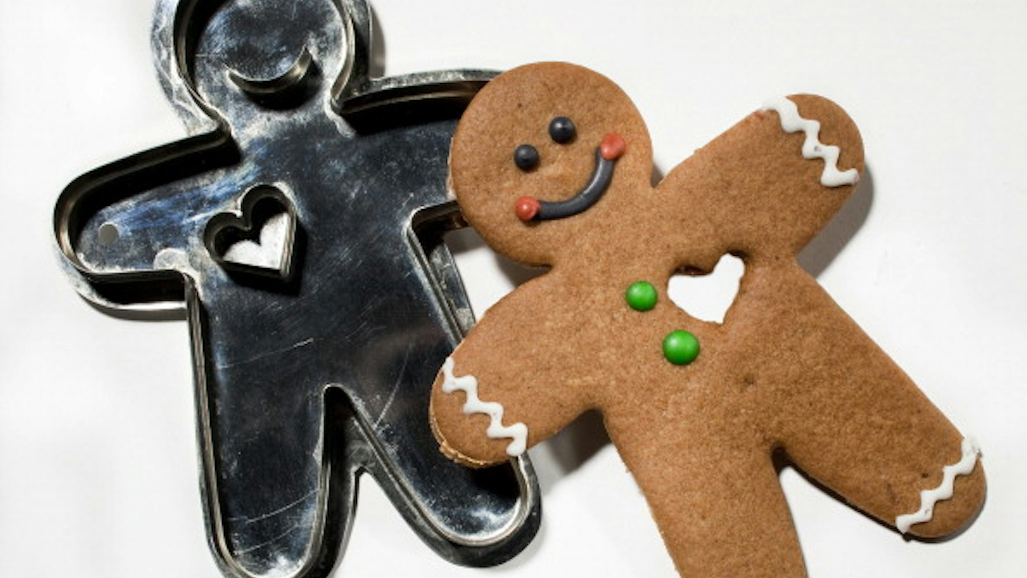 We are pressing cookie cutters in whimsical shapes, old-fashioned simple shapes, and once-a-year shapes into soft buttery dough. Here, gingerbread man with heart from Hammersong/LaCuisine.