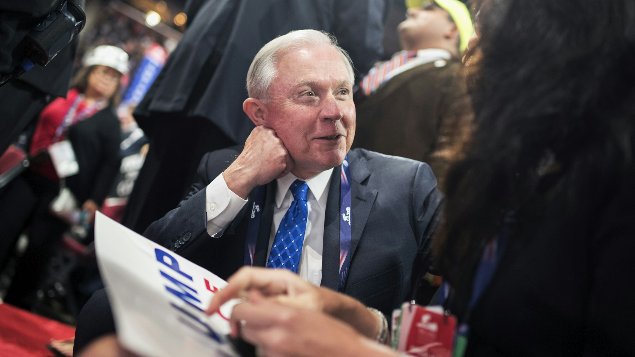 Sen. Jeff Sessions, R-Ala., talks with Alabama delegates on the floor of the Quicken Loans Arena at the Republican National Convention in Cleveland, Ohio, July 20, 2016.