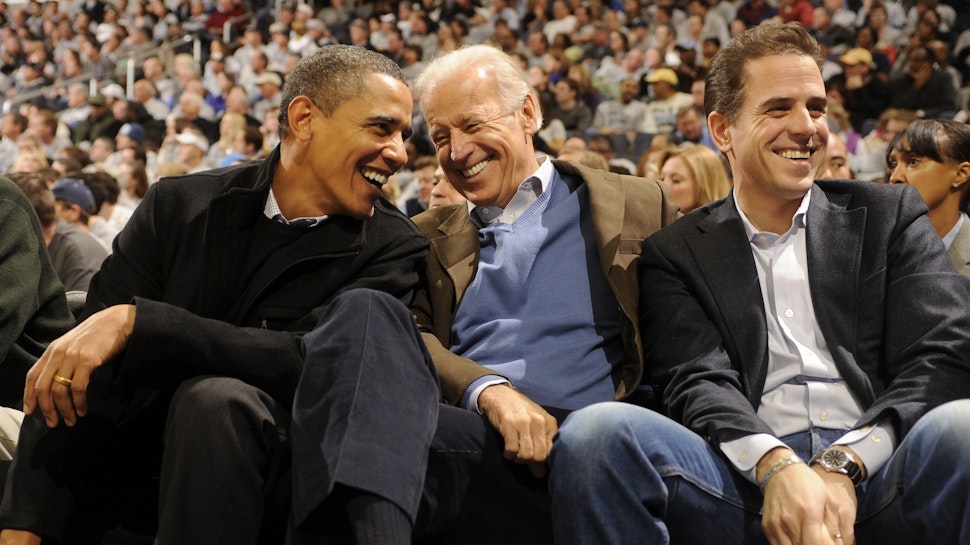 JANUARY 30: President of the United States Barack Obama and Vice President Joe Biden and Hunter Biden (son of Joe Biden) talk during a college basketball game between Georgetown Hoyas and the Duke Blue Devils on January 30, 2010 at the Verizon Center in Washington DC.
