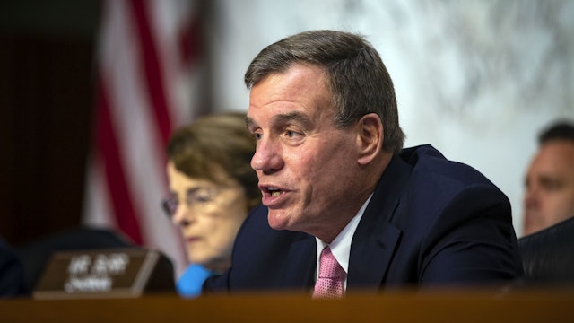 Sen. Mark Warner (D-VA), vice-chair of the Senate Intelligence Committee, questions retired Vice Adm. Joseph Maguire at his confirmation hearing, to become the director of the National Counterterrorism Center, on Capitol Hill, on July 25, 2018 in Washington, DC.