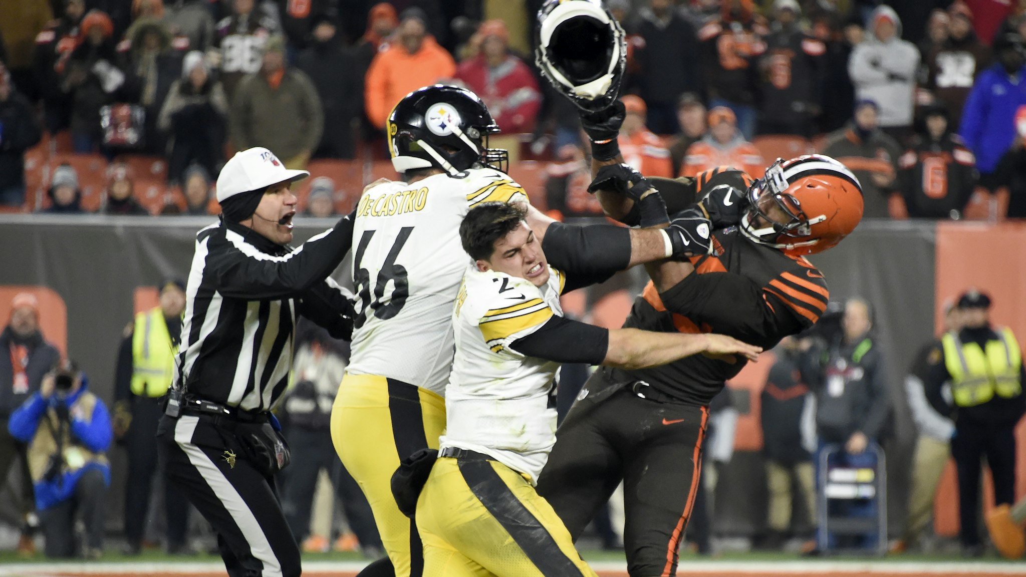 CLEVELAND, OHIO - NOVEMBER 14: Quarterback Mason Rudolph #2 of the Pittsburgh Steelers fights with defensive end Myles Garrett #95 of the Cleveland Browns during the second half at FirstEnergy Stadium on November 14, 2019 in Cleveland, Ohio. The Browns defeated the Steelers 21-7.