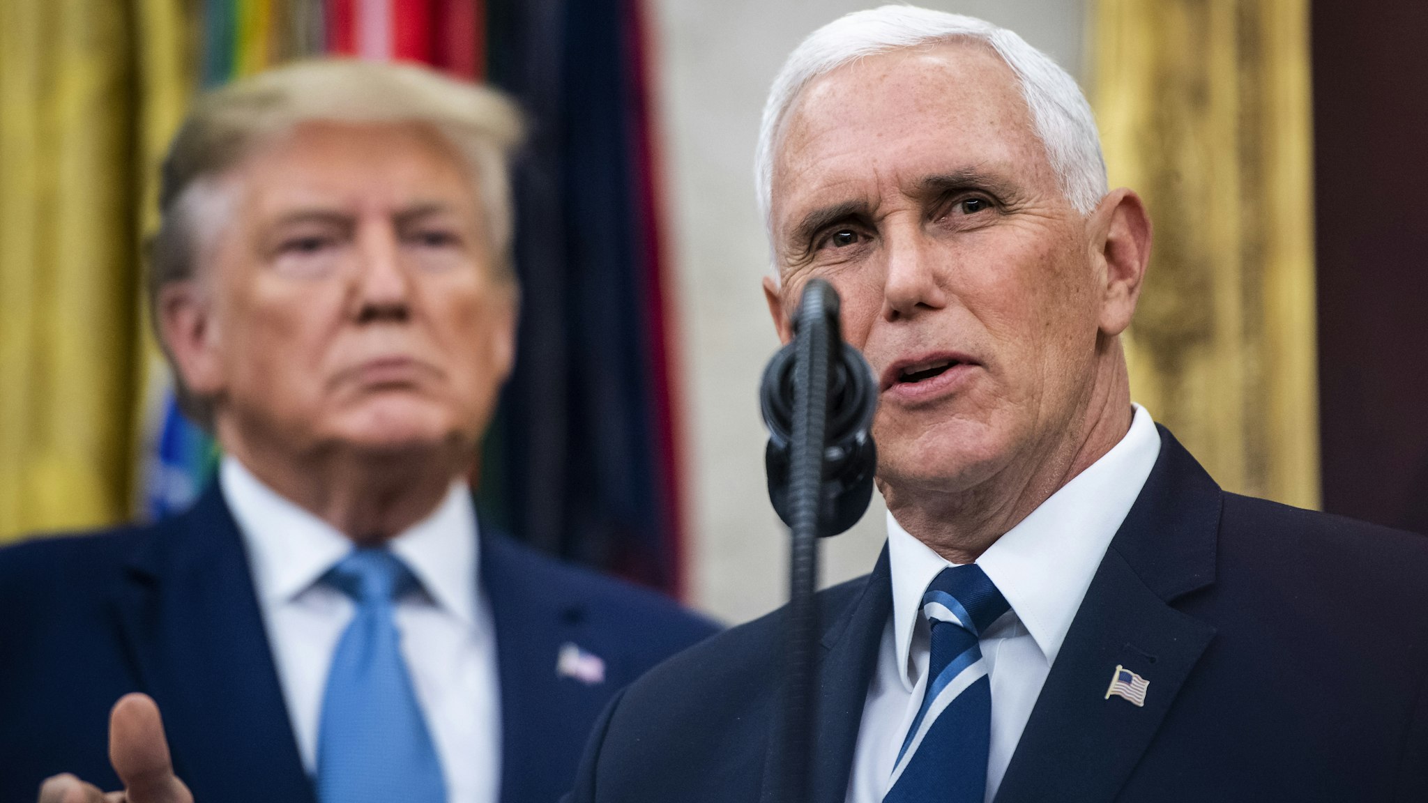 WASHINGTON, DC - OCTOBER 8 : President Donald J. Trump listens to Vice President Mike Pence speak during a ceremony to award the Presidential Medal of Freedom to Edwin Meese III in the Oval Office at the White House on Tuesday, Oct 08, 2019 in Washington, DC.