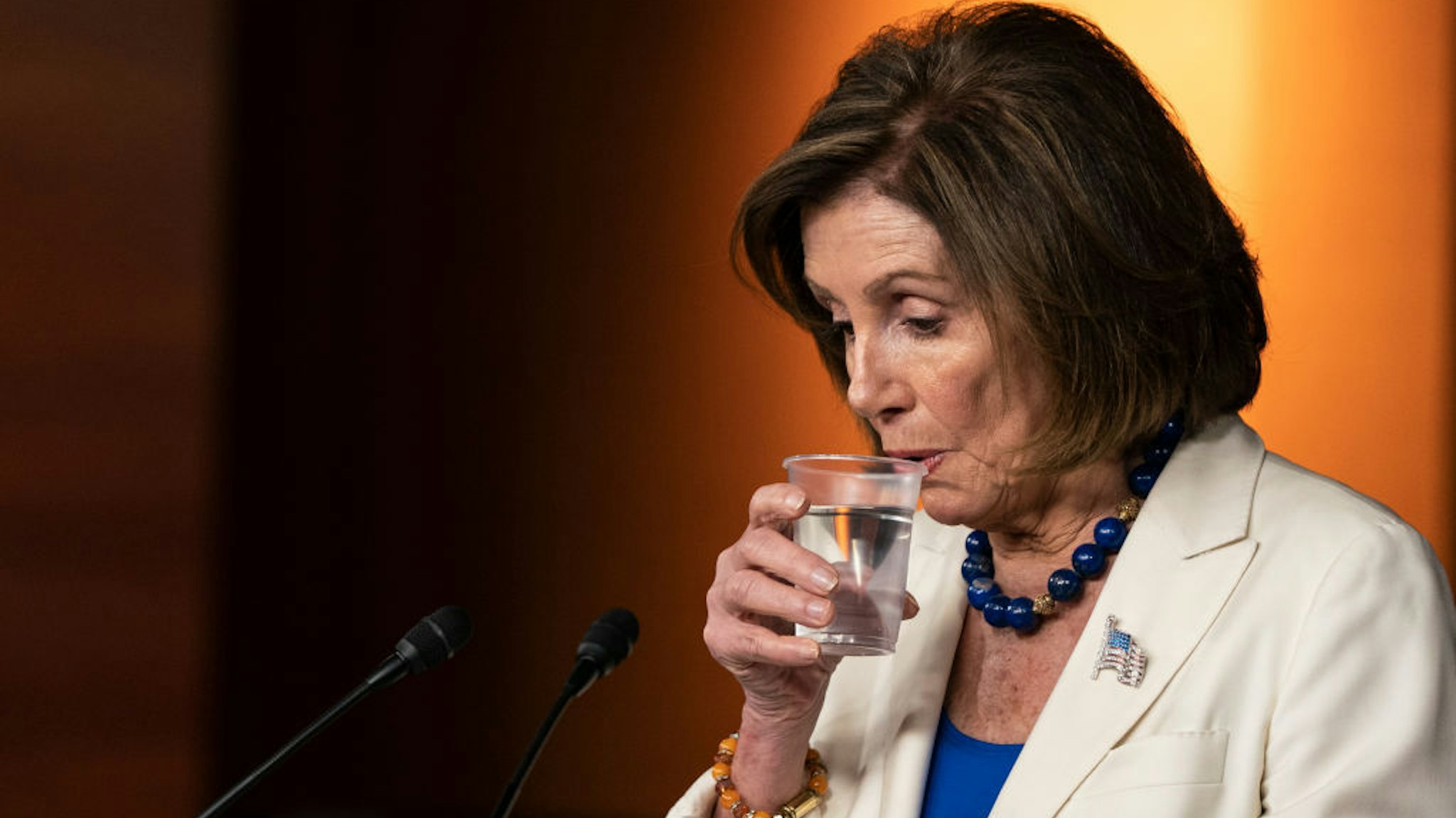 House Speaker Nancy Pelosi (D-CA) takes a sip of water as she speaks to the media during her weekly press conference at the U.S. Capitol on November 21, 2019 in Washington, DC. Pelosi spoke about her legislative plans through the new year and the lack of progress she feels the Senate is making on passing legislation the House has already passed. She then took questions. (Photo by Alex Edelman/Getty Images)