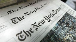 The New York Times Co. Post An 82 Percent Decline In 2nd Quarter Profi NEW YORK - JULY 23: Copies of the New York Times sit for sale in a rack July 23, 2008 in New York City. The New York broadsheet announced it posted an 82 percent decline in second quarter profits as compared to last year. It also announced it would raise its newsstand price 25 cents to a $1.50.
