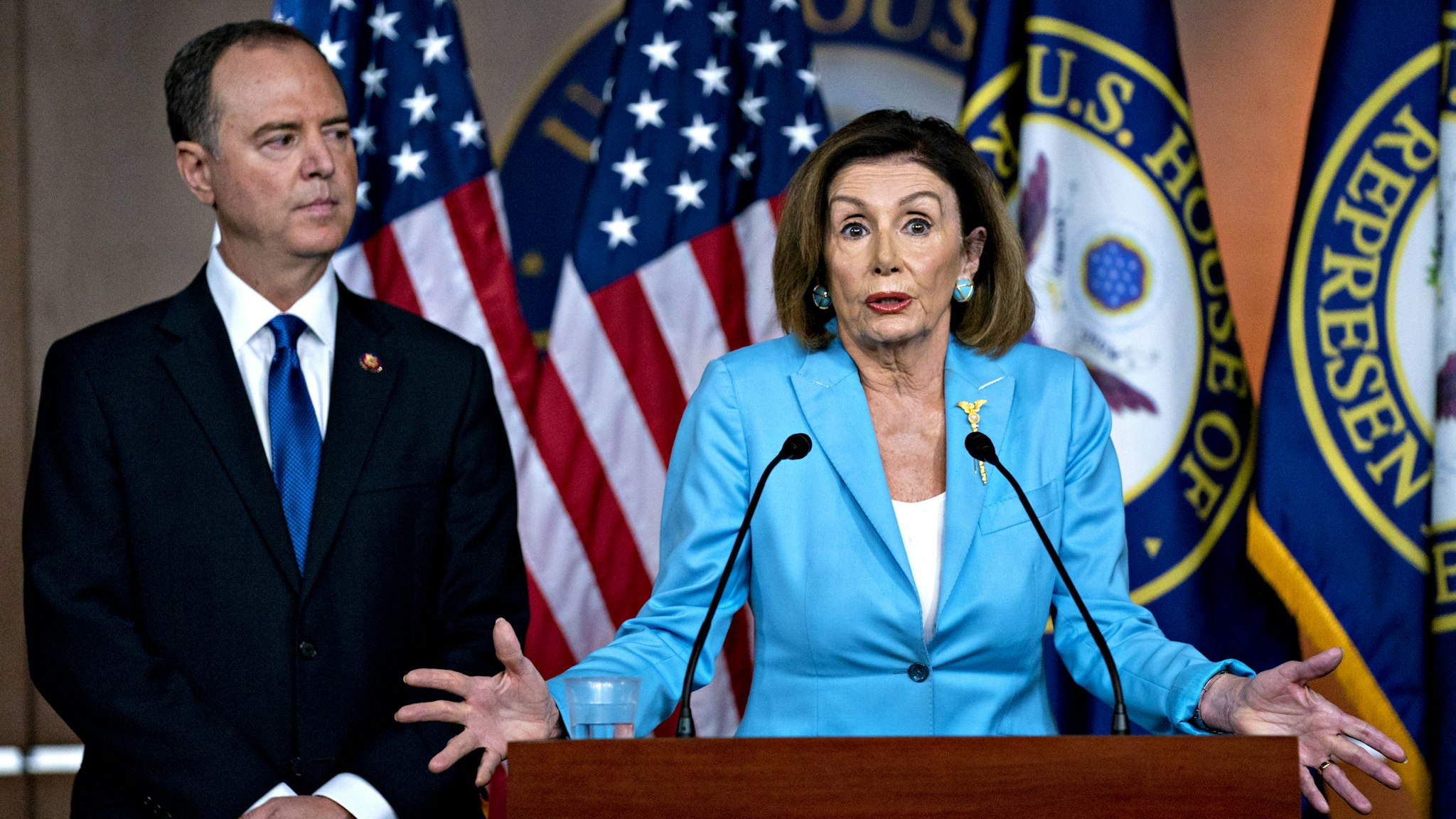 U.S. House Speaker Nancy Pelosi, a Democrat from California, speaks as Representative Adam Schiff, a Democrat from California and chairman of the House Intelligence Committee, left, listens during a news conference on Capitol Hill in Washington, D.C., U.S., on Wednesday, Oct. 2, 2019. Three House committee chairmen threatened on Wednesday to subpoena the White House if it fails to adhere by Friday to document requests related to allegations that President Donald Trump pressured Ukraine into investigating one of his leading political rivals.