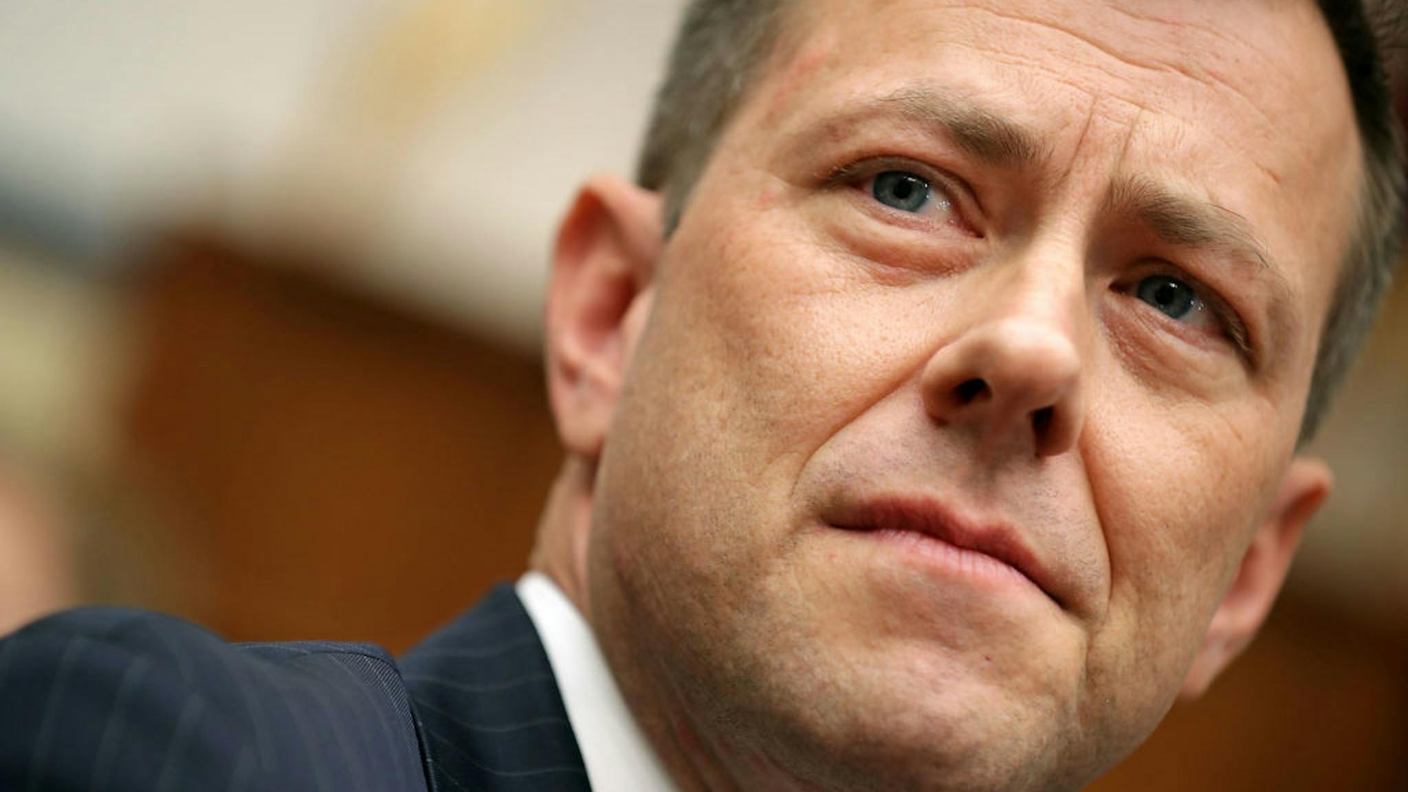 Peter Strzok Deputy Assistant FBI Director Peter Strzok (C) waits to testify before a joint committee hearing of the House Judiciary and Oversight and Government Reform committees in the Rayburn House Office Building on Capitol Hill July 12, 2018 in Washington, DC. While involved in the probe into Hillary Clinton's use of a private email server in 2016, Strzok exchanged text messages with FBI attorney Lisa Page that were critical of Trump. After learning about the messages, Mueller removed Strzok from his investigation into whether the Trump campaign colluded with Russia to win the 2016 presidential election. (Photo by Chip Somodevilla/Getty Images)