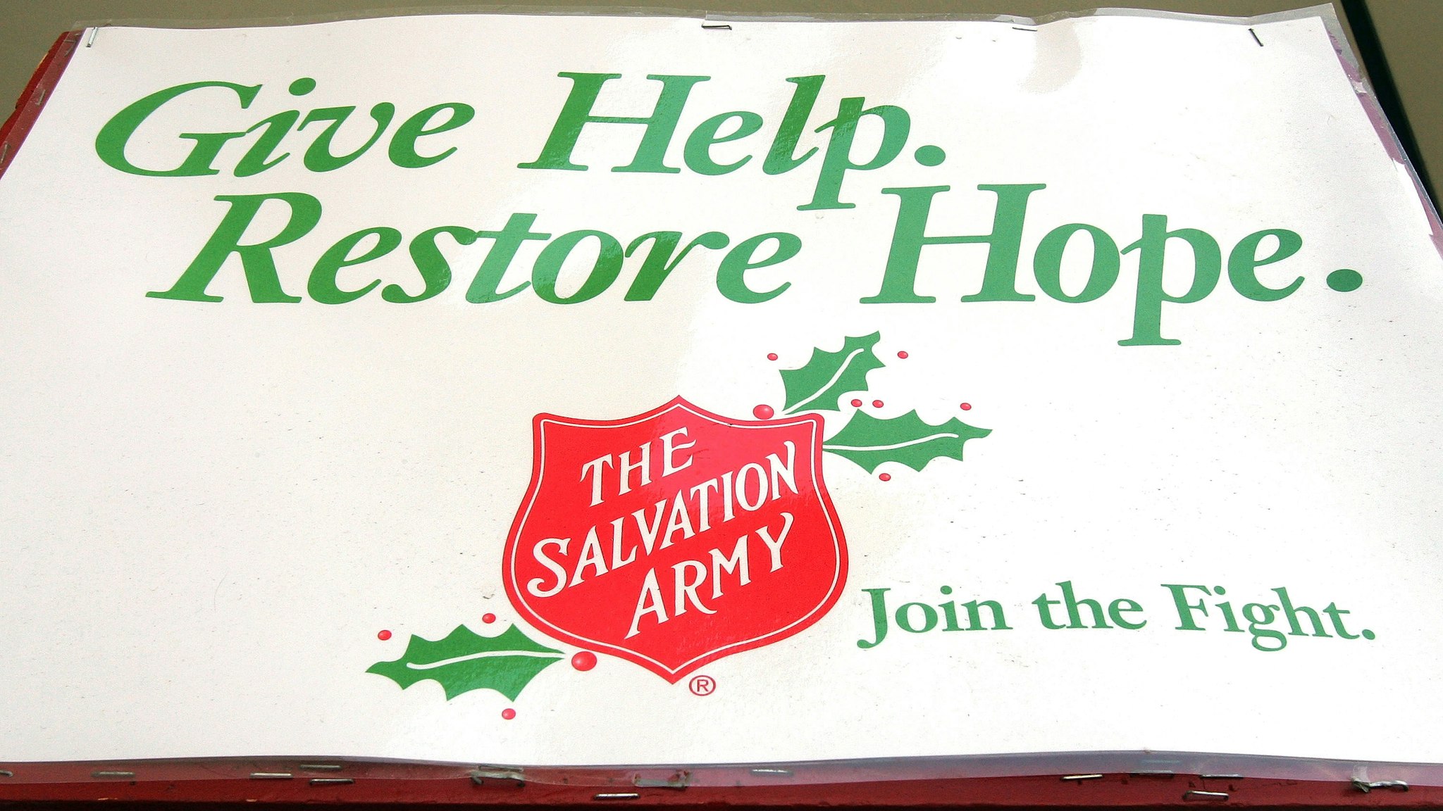 CHICAGO - DECEMBER 2: The Salvation Army creed is seen on a bell ringer's pole in front of a Kmart store December 2, 2004 in Chicago, Illinois. Several major national retailers have banned Salvation Army bell ringers, including Target stores.