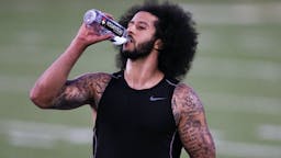 Colin Kaepernick Colin Kaepernick drinks water during the Colin Kaepernick NFL workout held at Charles R. Drew High School on November 16, 2019 in Riverdale, Georgia.