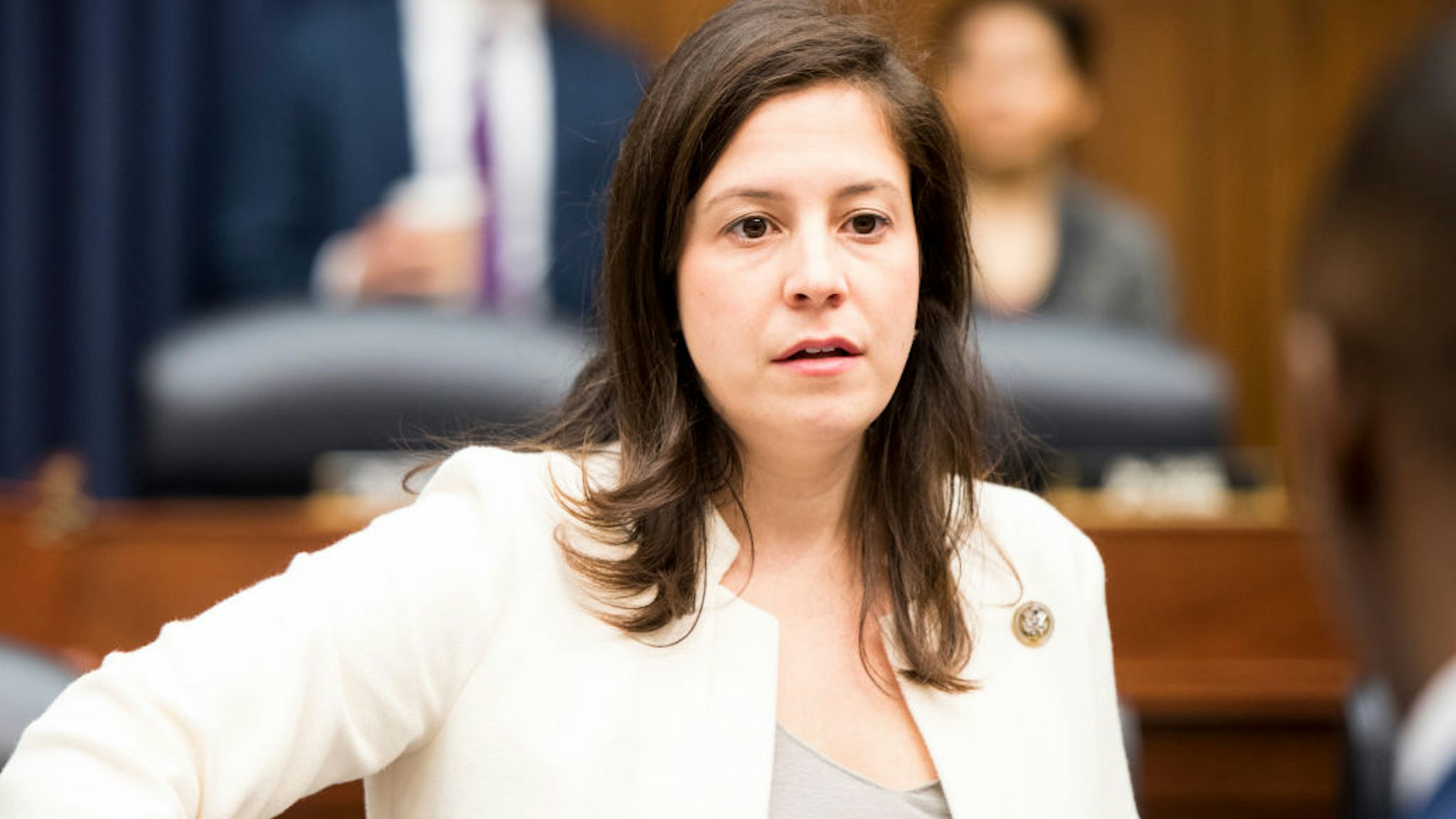Elise Stefanik takes her seat for the House Armed Services Committee hearing