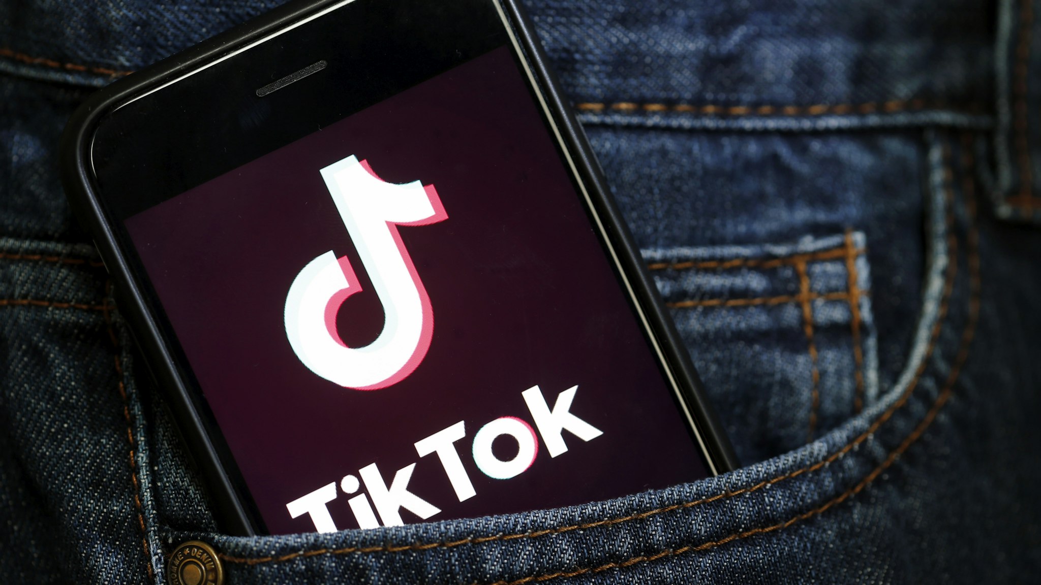 PARIS, FRANCE - MARCH 05: In this photo illustration, the social media application logo, Tik Tok is displayed on the screen of an iPhone on March 05, 2019 in Paris, France. The social network broke the rules for the protection of children's online privacy (COPPA) and was fined $ 5.7 million. The fact TikTok criticized is quite serious in the United States, the platform, which currently has more than 500 million users worldwide, collected data that should not have asked minors. TikTok, also known as Douyin in China, is a media app for creating and sharing short videos. Owned by ByteDance, Tik Tok is a leading video platform in Asia, United States, and other parts of the world. In 2018, the application gained popularity and became the most downloaded app in the U.S. in October 2018.