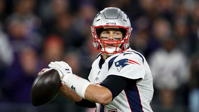 Tom Brady #12 of the New England Patriots looks to pass against the Baltimore Ravens during the first half at M&amp;T Bank Stadium on November 3, 2019 in Baltimore, Maryland. (Photo by Scott Taetsch/Getty Images)