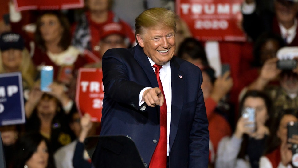 President Donald Trump points toward the crowd during a Keep America Great campaign rally at BancorpSouth Arena on November 1, 2019 in Tupelo, Mississippi. Trump is campaigning in Mississippi ahead of the state's gubernatorial election where Republican candidate Tate Reeves is in a close race with Democrat Jim Hood.