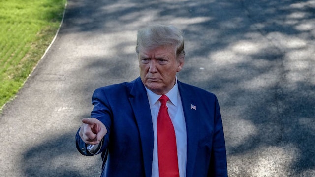 U.S. President Donald Trump takes a question from a member of the media before boarding Marine One on the South Lawn of the White House in Washington, D.C., U.S., on Thursday, Oct. 10, 2019. Trump said the first day of high level trade negotiations between the U.S. and China went very well and he'll meet the top Chinese negotiator on Friday.