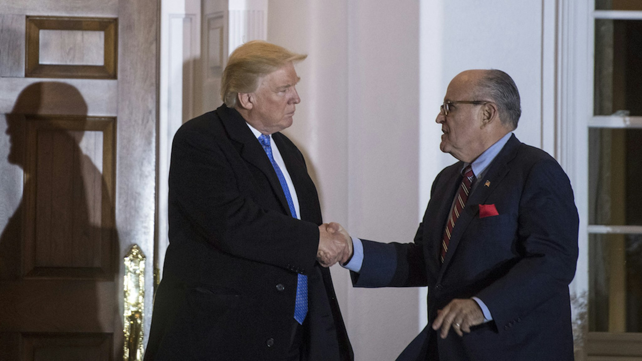 President-elect Donald Trump talks with Rudy Giuliani after a meeting at the clubhouse at Trump National Golf Club Bedminster in Bedminster Township, N.J. on Sunday, Nov. 20, 2016. (Photo by Jabin Botsford/The Washington Post via Getty Images)