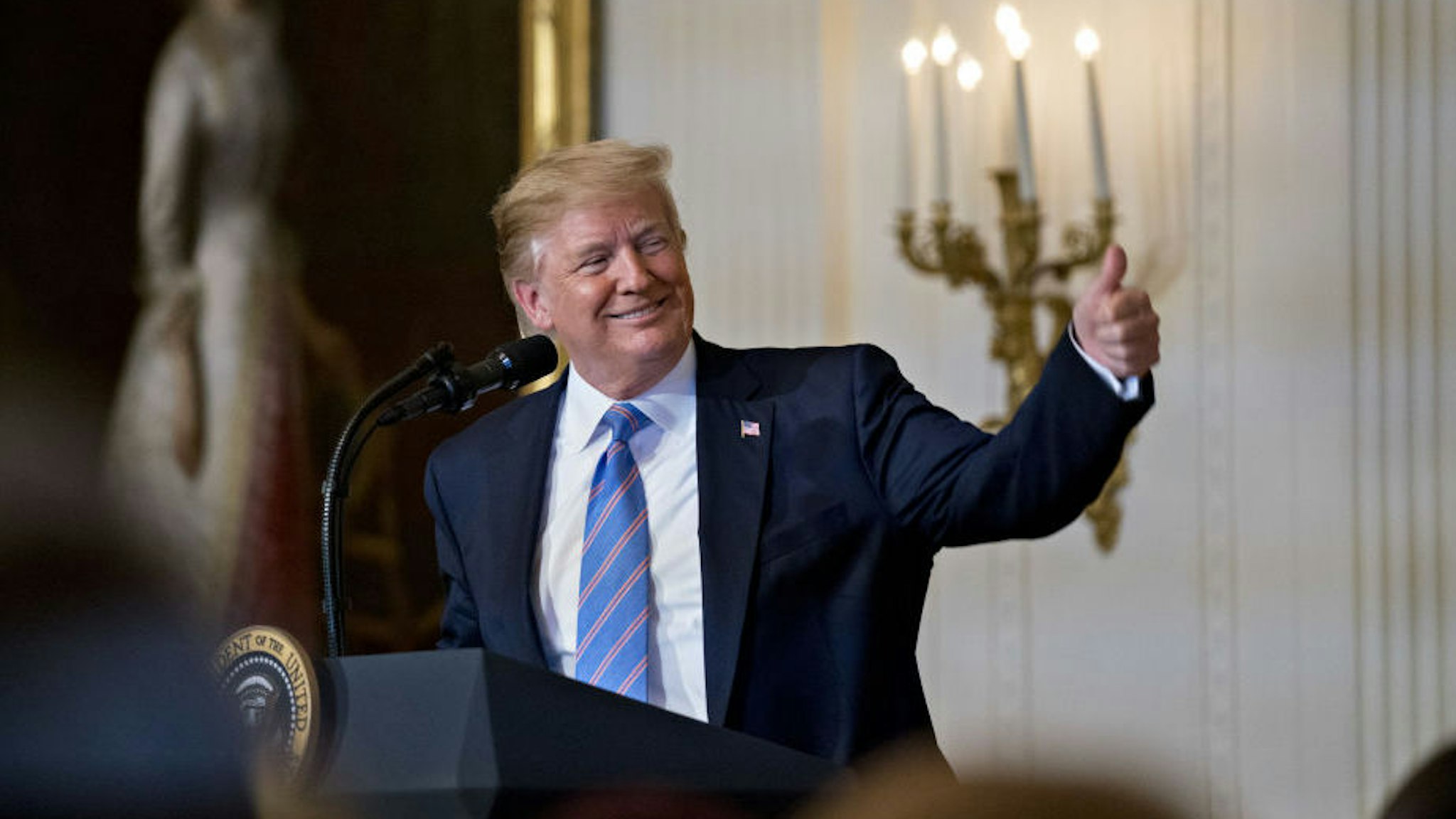 U.S. President Donald Trump gives a thumbs up while speaking during a Celebration of Military Mothers event in the East Room of the White House in Washington, D.C., U.S., on Friday, May 10, 2019. Trump's administration told China it has a month to seal a trade deal or face tariffs on all its exports to the U.S., even as both sides sought to avoid a public breakdown in negotiations despite a developing stalemate.