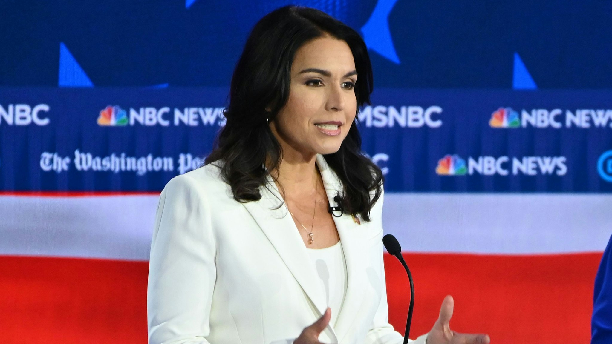 Democratic presidential hopefuls Representative for Hawaii Tulsi Gabbard (L) speaks as Minnesota Senator Amy Klobuchar listens during the fifth Democratic primary debate of the 2020 presidential campaign season co-hosted by MSNBC and The Washington Post at Tyler Perry Studios in Atlanta, Georgia on November 20, 2019.