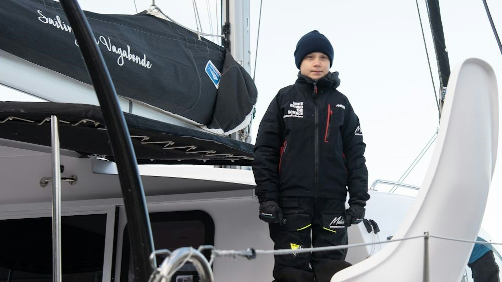 Swedish climate activist Greta Thunberg stands aboard the catamaran La Vagabonde as she sets sail to Europe in Hampton, Virginia, on November 13, 2019. - "Extremely educational" is how Greta Thunberg sums up her North American sojourn as she prepares to cross the Atlantic once more, this time bound back for Europe. The 16-year-old Swede, who became world famous for founding the "school strikes for the climate," will set sail Wednesday morning, weather permitting, after 11 hectic weeks of criss-crossing the US and Canada, making headlines at every turn.
