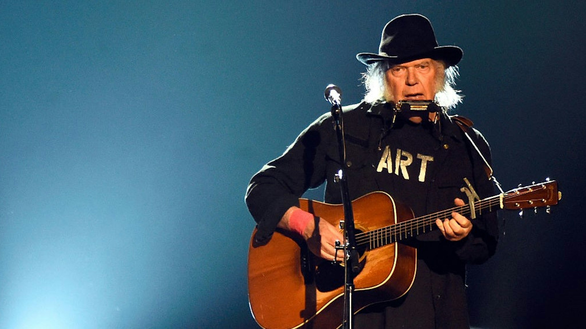 Singer Neil Young performs onstage at the 25th anniversary MusiCares 2015 Person Of The Year Gala honoring Bob Dylan at the Los Angeles Convention Center on February 6, 2015 in Los Angeles, California. The annual benefit raises critical funds for MusiCares' Emergency Financial Assistance and Addiction Recovery programs.