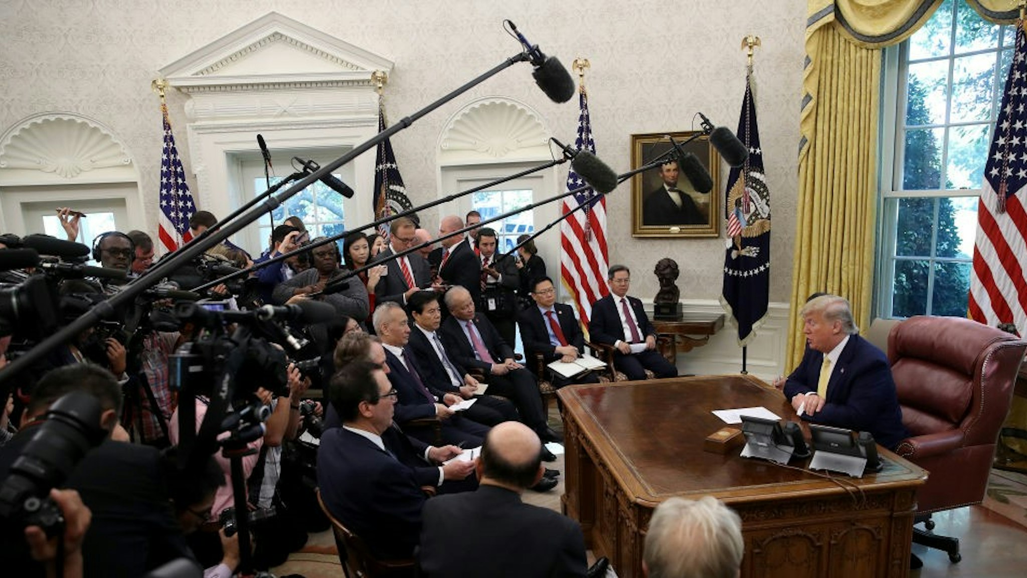 U.S. President Donald Trump meets with Chinese Vice Premier Liu He and members of the trade negotiation teams while announcing a "phase one" trade agreement with China in the Oval Office at the White House October 11, 2019 in Washington, DC. China and the United States have slapped each other with hundreds of billions of dollars in tariffs since the current trade war began between the world’s two largest national economies in 2018.