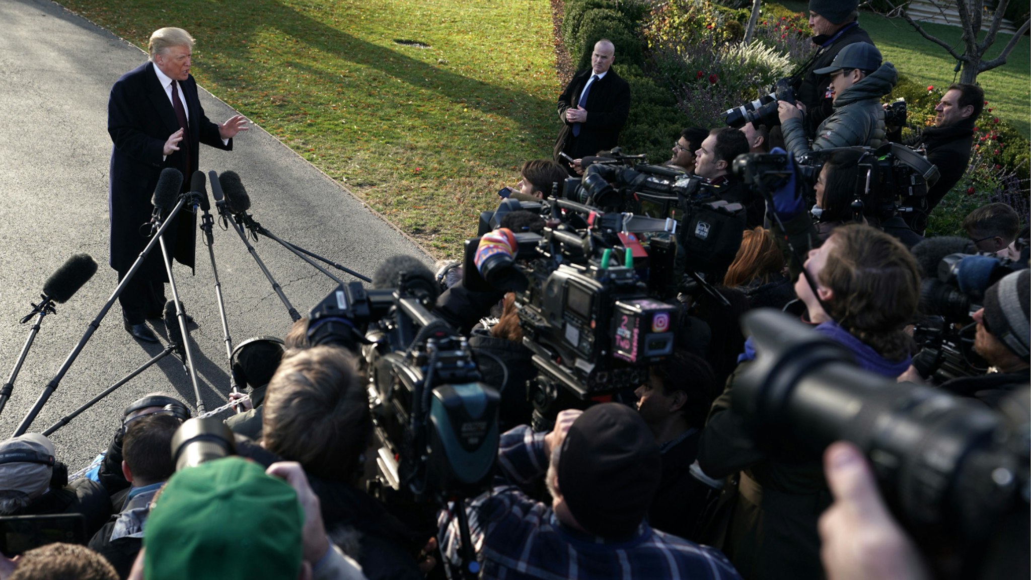 President Donald Trump speaks to members of the media prior to his departure from the White House November 20, 2018 in Washington, DC.