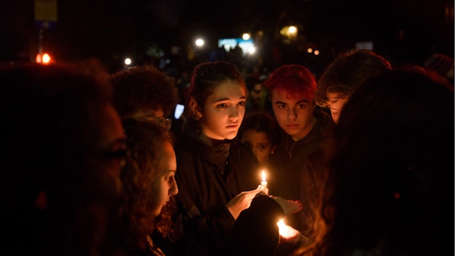People gather for a interfaith candlelight vigil a few blocks away from the site of a mass shooting at the Tree of Life Synagogue on October 27, 2018 in Pittsburgh, Pennsylvania.
