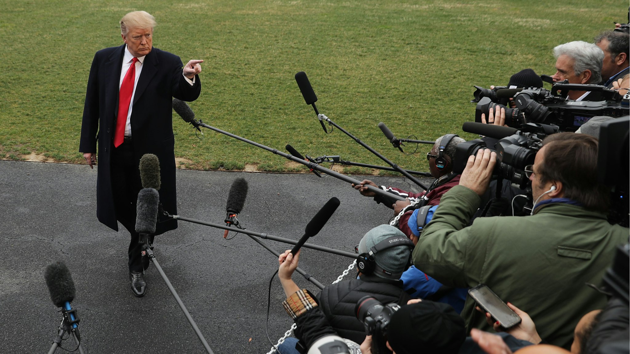 U.S. President Donald Trump talks to reporters before departing the White House March 22, 2019 in Washington, DC.