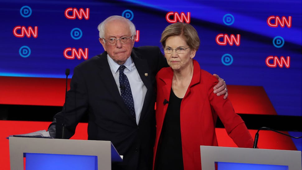 Sanders and Warren. Democratic presidential candidate Sen. Bernie Sanders (I-VT) (L) and Sen. Elizabeth Warren (D-MA) embrace after the Democratic Presidential Debate at the Fox Theatre July 30, 2019 in Detroit, Michigan.