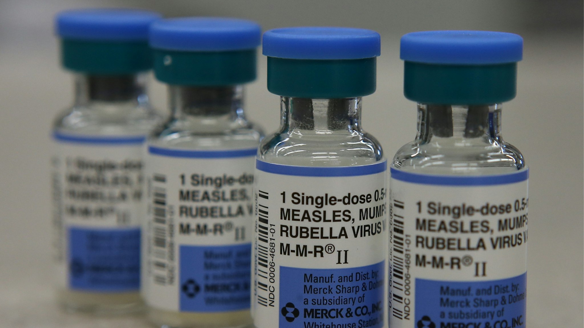 In this photo illustration, vials of measles, mumps and rubella vaccine are displayed on a counter at a Walgreens Pharmacy on January 26, 2015 in Mill Valley, California.
