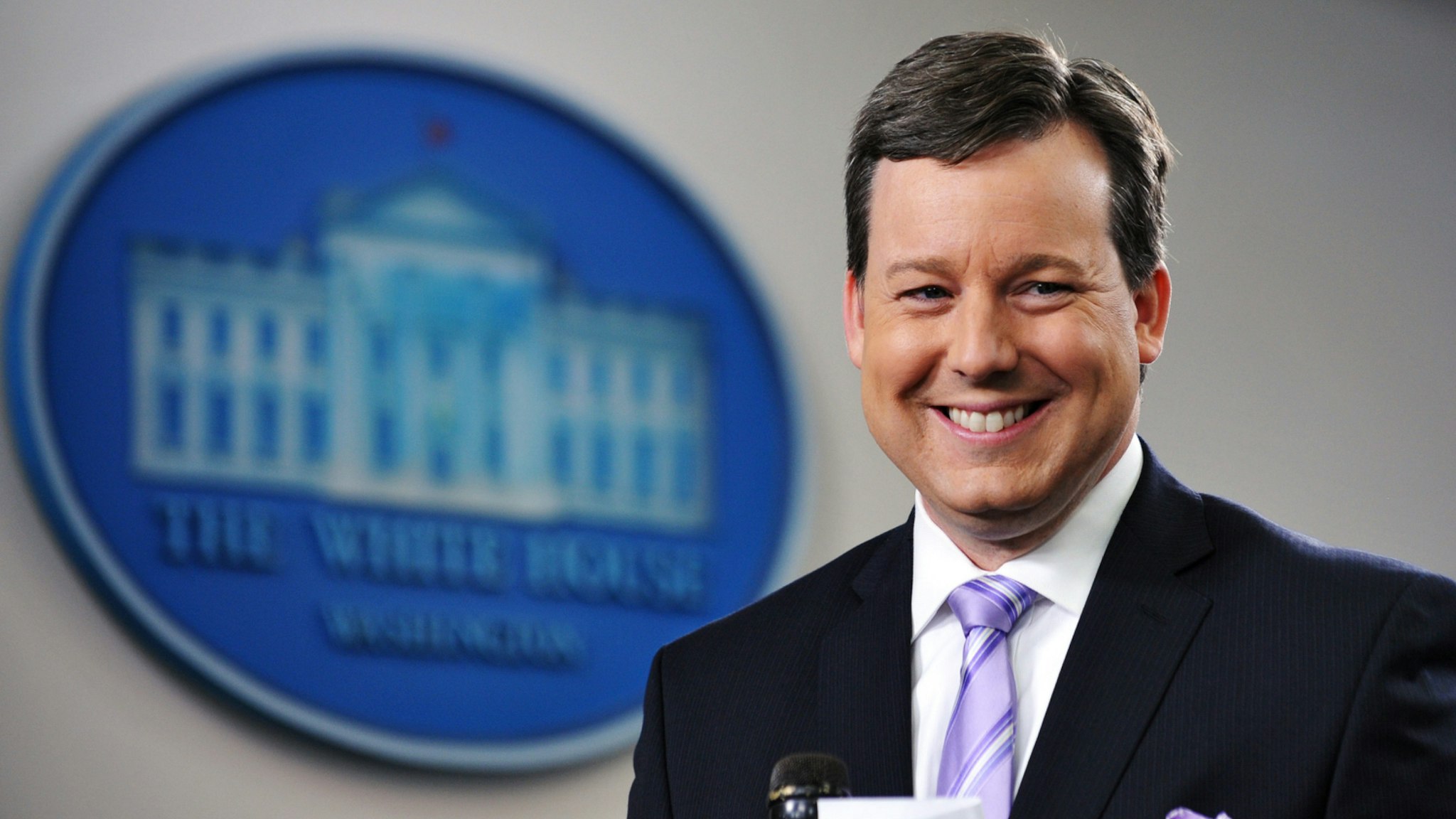 Fox White House correspondent Ed Henry prepares to do a stand-up December 8, 2011 in the Brady Briefing Room of the White House in Washington, DC.