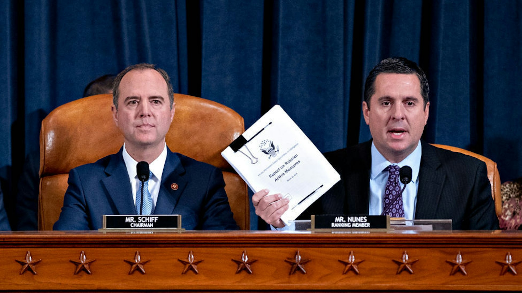 Representative Devin Nunes, a Republican from California and ranking member of the House Intelligence Committee, right, speaks as Representative Adam Schiff, a Democrat from California and chairman of the House Intelligence Committee, listens during an impeachment inquiry hearingon Capitol Hill November 21, 2019 in Washington, DC. The committee heard testimony during the fifth day of open hearings in the impeachment inquiry against U.S. President Donald Trump, whom House Democrats say held back U.S. military aid for Ukraine while demanding it investigate his political rivals. (Photo by Andrew Harrer-Pool/Getty Images)