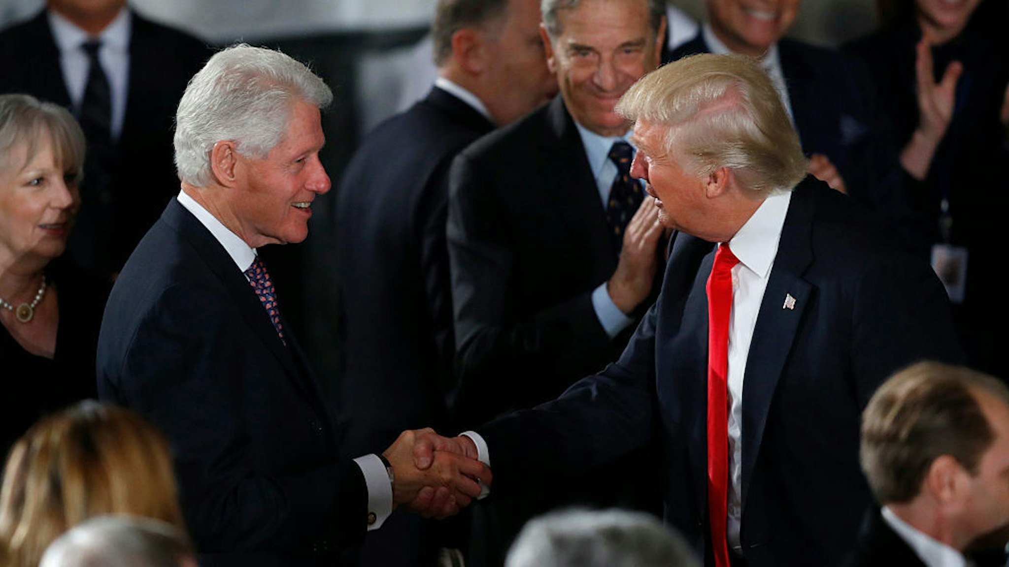 President Donald Trump greets former President Bill Clinton at the Inaugural Luncheon in the US Capitol January 20, 2017 in Washington, DC. President Trump will attend the luncheon along with other dignitaries. (Photo by Aaron P. Bernstein/Getty Images)