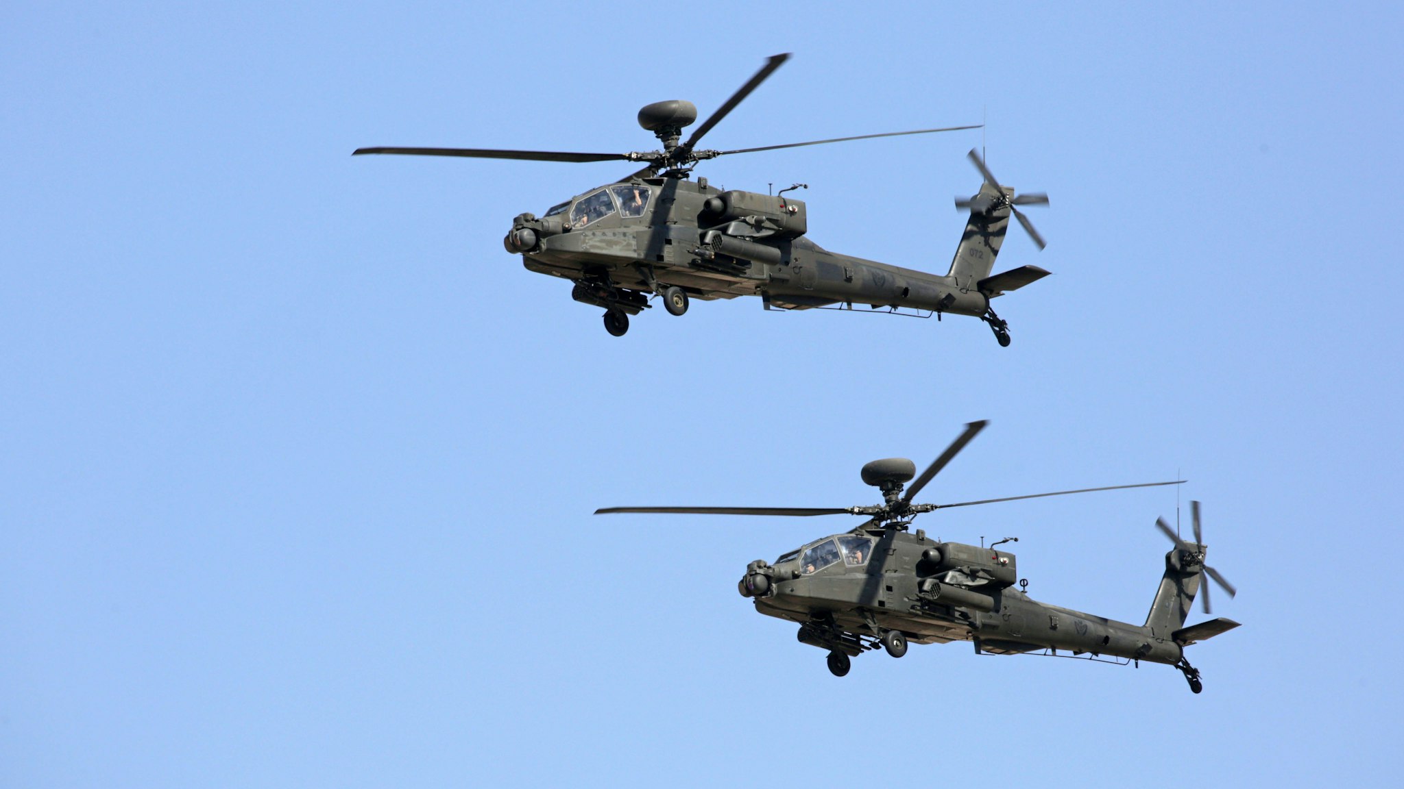 DUBAI, UNITED ARAB EMIRATES - NOVEMBER 17, 2019: Boeing AH-64 Apache attack helicopters perform at the 2019 Dubai Airshow.
