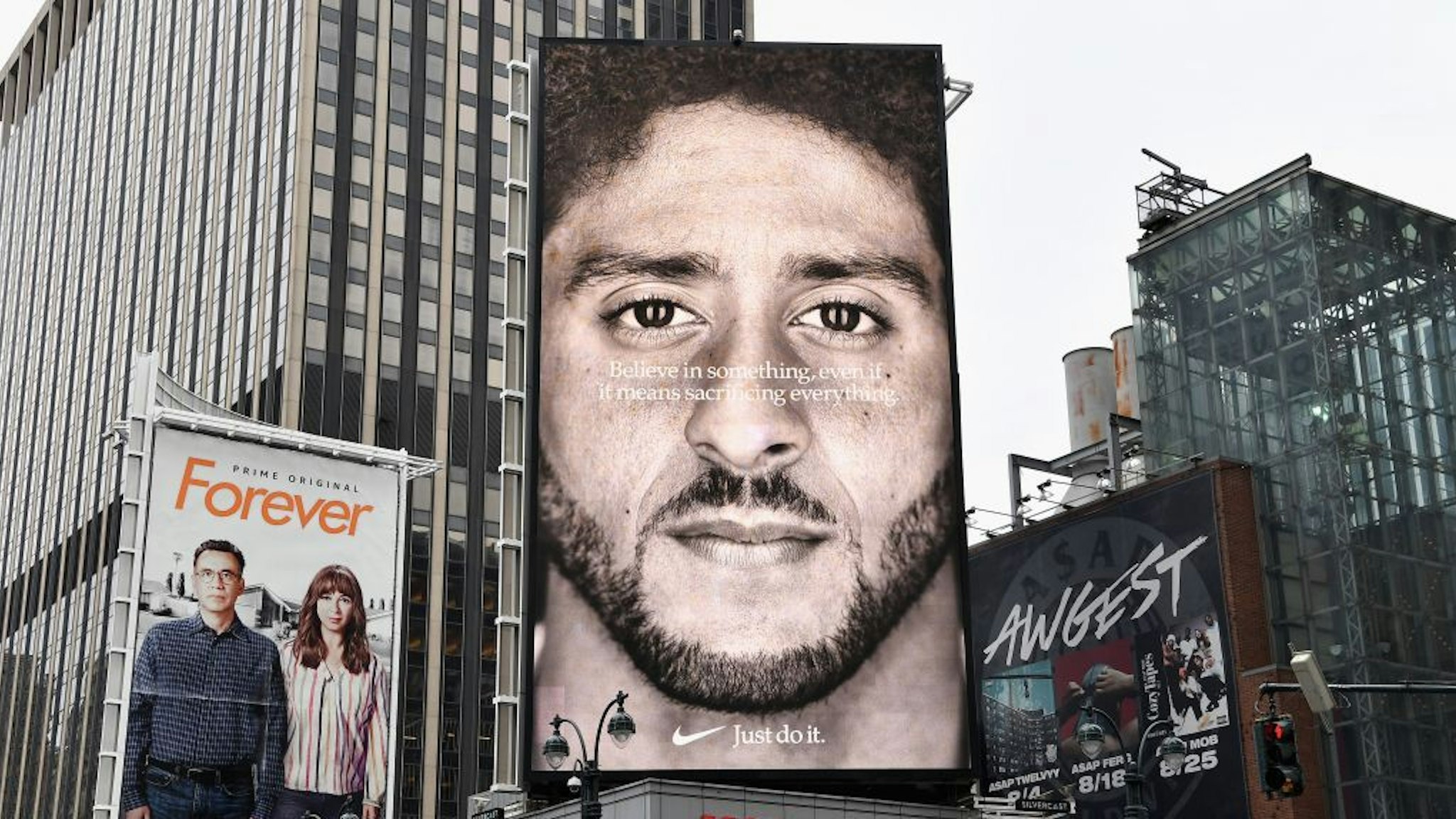 A Nike Ad featuring American football quarterback Colin Kaepernick is on diplay September 8, 2018 in New York City. - Nike's new ad campaign featuring Kaepernick, the American football player turned activist against police violence, takes a strong stance on a divisive issue which could score points with millennials but risks alienating conservative customers. The ads prompted immediate calls for Nike boycotts over Kaepernick, who has been castigated by US President Donald Trump and other conservatives over his kneeling protests during the playing of the US national anthem. (Photo by Angela Weiss / AFP) (Photo credit should read ANGELA WEISS/AFP via Getty Images)