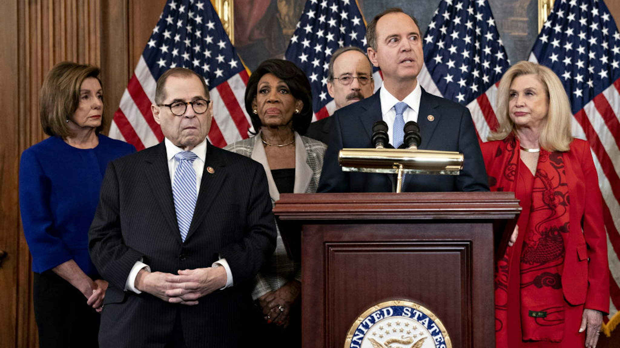 Representative Adam Schiff, a Democrat from California and chairman of the House Intelligence Committee, second right, speaks as U.S. House Speaker Nancy Pelosi, a Democrat from California, from left, Representative Jerry Nadler, a Democrat from New York and chairman of the House Judiciary Committee, Representative Maxine Waters, a Democrat from California and chairwoman of the House Financial Services Committee, Representative Eliot Engel, a Democrat from New York and chairman of the House Foreign Affairs Committee, and Representative Carolyn Maloney, a Democrat from New York and chairwoman of the House Oversight Committee, listen during a news conference announcing the next steps in the impeachment inquiry at the U.S. Capitol in Washington, D.C., U.S., on Tuesday, Dec. 10, 2019. House Democrats unveiled two articles of impeachment against President Donald Trump, one on abuse of power and the other involving obstruction of Congress. Photographer: Andrew Harrer/Bloomberg