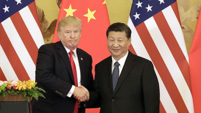 U.S. President Donald Trump, left, and Xi Jinping, China's president, shake hands during a news conference at the Great Hall of the People in Beijing, China, on Thursday, Nov. 9, 2017. Donald Trump and Vladimir Putin will meet in Helsinki, Finland, on July 16 for their first bilateral summit as the leaders seek to reverse a downward spiral in relations that has been exacerbated by findings that Russia meddled in U.S. elections. Our editors select a set of archive images of U.S. President Donald Trump ahead of the summit meeting. Photographer: Qilai Shen/Bloomberg